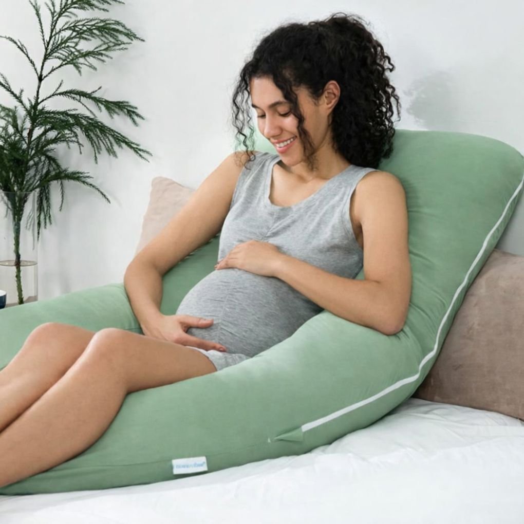 U shaped pregnancy pillow used for postpartum recovery and back support for new mothers after delivery in India