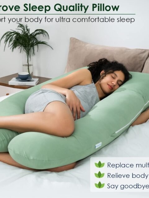 Pregnant woman in third trimester using U shaped pregnancy pillow for full body support and comfort in India